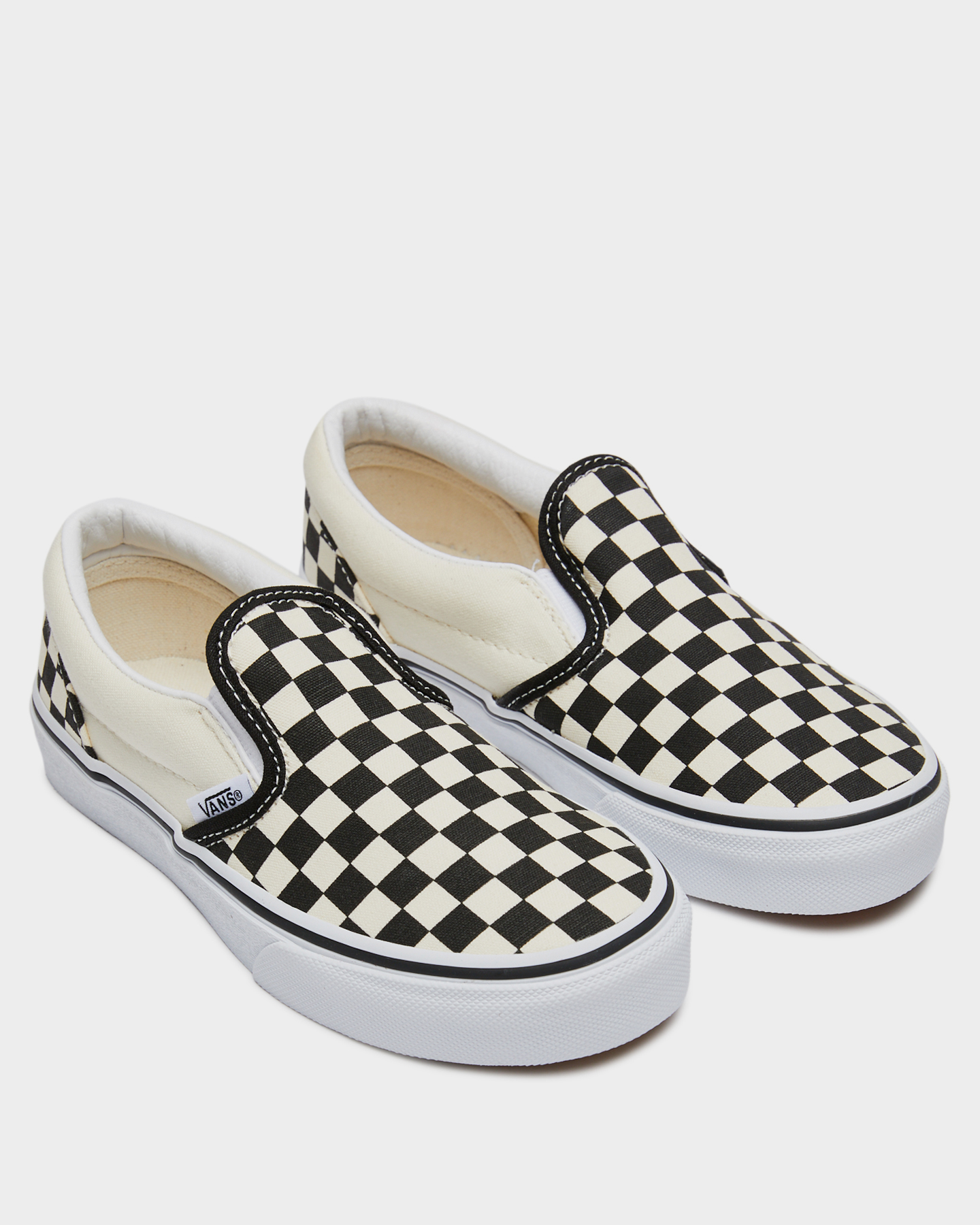 white slip on vans youth