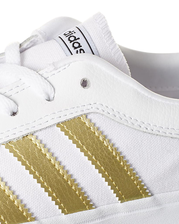 white adidas shoes with gold