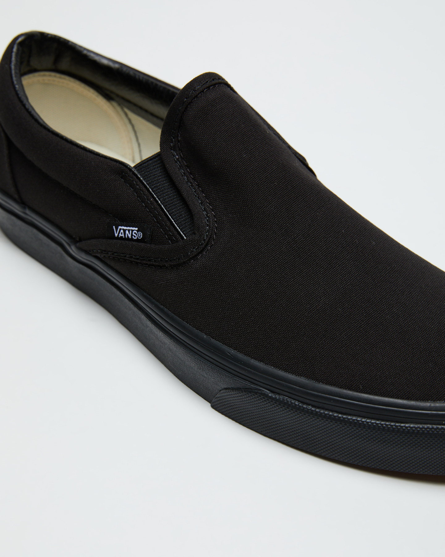 black leather vans slip ons mens